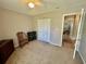 Carpeted bedroom with ceiling fan, closet and doorway leading to the rest of the home at 706 Jamie Ln., Conway, SC 29526