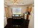Bright dining area featuring an eating area, view to the exterior and dark flooring at 706 Jamie Ln., Conway, SC 29526