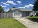 Charming single-story home with a well-manicured lawn, long driveway, and light gray siding at 706 Jamie Ln., Conway, SC 29526