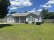 Inviting home with a well-manicured lawn, tidy shrubbery, and attractive facade at 706 Jamie Ln., Conway, SC 29526