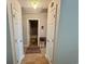 Hallway area featuring wood-look flooring, neutral walls, and multiple entryways at 706 Jamie Ln., Conway, SC 29526