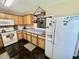 Functional kitchen featuring tile floors, white appliances, and ample counter space at 706 Jamie Ln., Conway, SC 29526