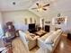 Bright living room featuring high ceilings, hardwood floors, and stylish furnishings at 706 Jamie Ln., Conway, SC 29526