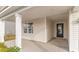 Charming covered entrance with a black front door and manicured landscaping at 7167 Shooting Star Way, Myrtle Beach, SC 29579
