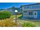 Backyard patio with a table and chairs, lush landscaping and views of the surrounding property at 832 Villa Dr. # 832, North Myrtle Beach, SC 29582