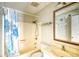 Cozy bathroom featuring a shower-tub combo, patterned shower curtain, toilet, and sink at 832 Villa Dr. # 832, North Myrtle Beach, SC 29582