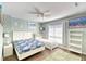 Well-lit bedroom with two beds, complemented by soft colors and seaside-themed decorations at 832 Villa Dr. # 832, North Myrtle Beach, SC 29582
