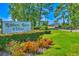 Entrance sign to Robbers Roost Villas amidst colorful flowers and manicured landscaping at 832 Villa Dr. # 832, North Myrtle Beach, SC 29582