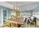 Dining room featuring pendant lighting and views through sliding doors into the sunny, outdoor space at 832 Villa Dr. # 832, North Myrtle Beach, SC 29582