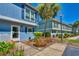 Exterior view of home with colorful plants, siding, shutters, and a landscaped yard at 832 Villa Dr. # 832, North Myrtle Beach, SC 29582