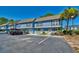 Charming two-story condo with a parking area and vibrant blue exterior at 832 Villa Dr. # 832, North Myrtle Beach, SC 29582
