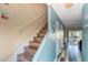 Entryway of home featuring wood stairs with handrail and coastal-themed decor at 832 Villa Dr. # 832, North Myrtle Beach, SC 29582