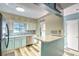 Bright kitchen with stainless steel appliances, a breakfast bar, and stylish countertops at 832 Villa Dr. # 832, North Myrtle Beach, SC 29582