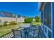Outdoor patio featuring a patio table set for seating and views of the backyard at 832 Villa Dr. # 832, North Myrtle Beach, SC 29582