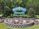 Welcoming sign for Myrtle Beach surrounded by lush greenery and colorful flowers at 8488 Idlewood Dr., Myrtle Beach, SC 29588