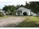 Charming home featuring a spacious driveway and a well-maintained front lawn surrounded by mature trees at 8488 Idlewood Dr., Myrtle Beach, SC 29588