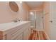 Well-lit bathroom featuring a single sink vanity and a walk-in shower with a glass door at 850 Fairway Dr. # 904Ee, Longs, SC 29568
