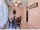 Cozy dining area with a round table, decorative ceiling fan, and inviting decor at 850 Fairway Dr. # 904Ee, Longs, SC 29568