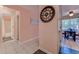Hallway with decorative clock and access to the bathroom and dining room at 850 Fairway Dr. # 904Ee, Longs, SC 29568