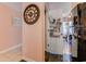 Hallway features a stylish clock and access to a well-organized pantry with ample storage at 850 Fairway Dr. # 904Ee, Longs, SC 29568