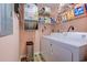 Efficient laundry room with washer, dryer, shelving, and a practical layout at 850 Fairway Dr. # 904Ee, Longs, SC 29568