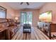 Comfortable living room features a leather couch, coffee table, and TV at 850 Fairway Dr. # 904Ee, Longs, SC 29568