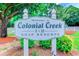 Signage for Colonial Creek I & II Golf Resorts is framed by lush greenery and mature trees at 850 Fairway Dr. # 904Ee, Longs, SC 29568