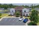 Aerial view showcasing the building with parking and a waterway at 8855 Radcliff Dr. Nw # 50B, Calabash, NC 28467