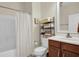 Bathroom with a shower and tub combination and open storage for essentials at 8855 Radcliff Dr. Nw # 50B, Calabash, NC 28467