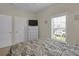 Bedroom with natural light, dresser, and closet for ample storage at 8855 Radcliff Dr. Nw # 50B, Calabash, NC 28467