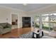 Comfortable living room with sliding glass doors offering views of the water and outdoor seating at 8855 Radcliff Dr. Nw # 50B, Calabash, NC 28467
