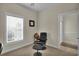Office area with a black leather chair and a window with natural light, creating an inviting workspace at 8855 Radcliff Dr. Nw # 50B, Calabash, NC 28467