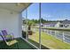 Relaxing screened porch with pond views and outdoor seating at 8855 Radcliff Dr. Nw # 50B, Calabash, NC 28467