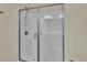 Walk-in shower with a glass door and modern fixtures, offering a clean and sleek design at 8855 Radcliff Dr. Nw # 50B, Calabash, NC 28467