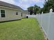 Expansive backyard with white fence, perfect for outdoor activities at 1028 Cherry Tree Ln., North Myrtle Beach, SC 29582