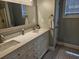 Bathroom vanity with double sinks, framed mirror, and ample storage in a neutral color palette at 1028 Cherry Tree Ln., North Myrtle Beach, SC 29582