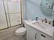 Bathroom with vanity, toilet, and tub with sliding doors at 1028 Cherry Tree Ln., North Myrtle Beach, SC 29582