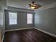 Spacious bedroom with neutral walls, attractive flooring, a ceiling fan, and good natural light at 1028 Cherry Tree Ln., North Myrtle Beach, SC 29582
