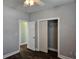 Bedroom with hardwood floors, closet, and open doorway for easy access at 1028 Cherry Tree Ln., North Myrtle Beach, SC 29582