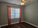 Comfortable bedroom with neutral walls and wood-look floors and lots of natural light at 1028 Cherry Tree Ln., North Myrtle Beach, SC 29582