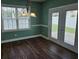 Inviting dining area features a large window, stylish chandelier, and access to the outdoor area at 1028 Cherry Tree Ln., North Myrtle Beach, SC 29582