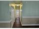 Bright hallway featuring neutral paint, trim, and attractive flooring that leads to the bathroom at 1028 Cherry Tree Ln., North Myrtle Beach, SC 29582
