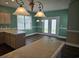 Bright eat-in kitchen with modern lighting and neutral decor at 1028 Cherry Tree Ln., North Myrtle Beach, SC 29582