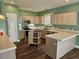 Spacious kitchen featuring stainless appliances and a central island at 1028 Cherry Tree Ln., North Myrtle Beach, SC 29582