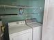 Practical laundry room with shelving above the washer and dryer units at 1028 Cherry Tree Ln., North Myrtle Beach, SC 29582