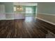Open-concept living area with hardwood floors and neutral paint scheme at 1028 Cherry Tree Ln., North Myrtle Beach, SC 29582