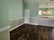 Spacious living room with hardwood floors and access to kitchen at 1028 Cherry Tree Ln., North Myrtle Beach, SC 29582