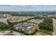 Wide aerial view showing the community and surrounding neighborhood and lake at 124 Birch N Coppice Dr. # 1, Surfside Beach, SC 29575