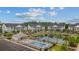 Aerial view showcasing complex, pool, and adjacent buildings at 124 Birch N Coppice Dr. # 1, Surfside Beach, SC 29575