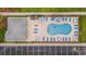 Overhead view of the pool area with ample seating and a cabana at 124 Birch N Coppice Dr. # 1, Surfside Beach, SC 29575
